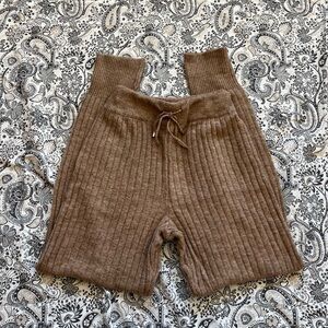 Tan ribbed sweatpants with drawstring waist and cuffed ankles